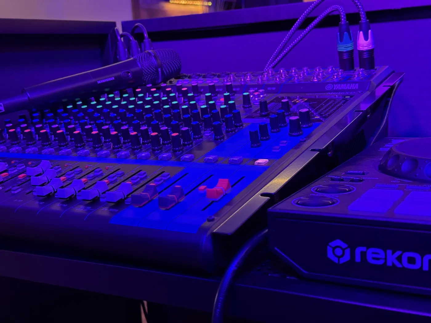 Yamaha MG-series mixer with Sennheiser wireless handheld microphone and DJ controller, at a Minnesota wedding setup