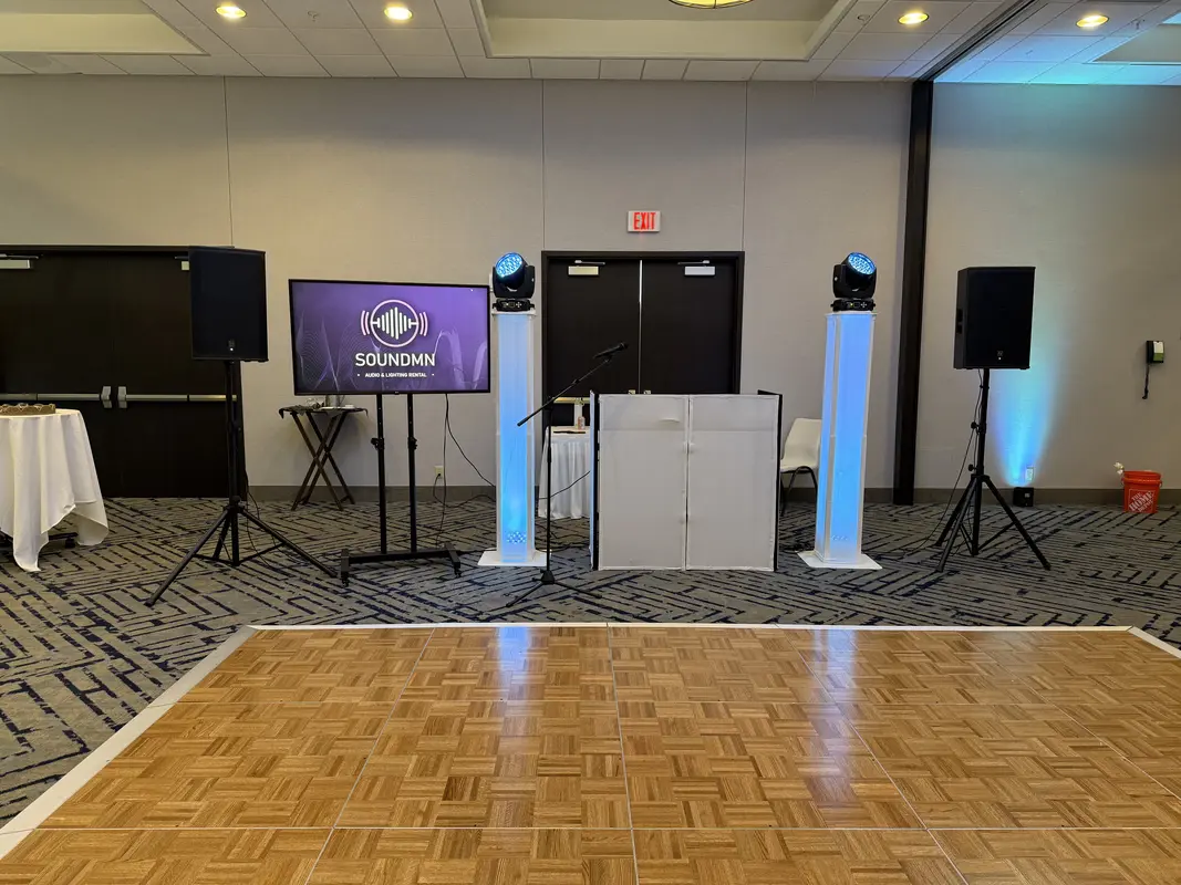 Outdoor festival with purple LED uplighting columns and crowd in Minneapolis