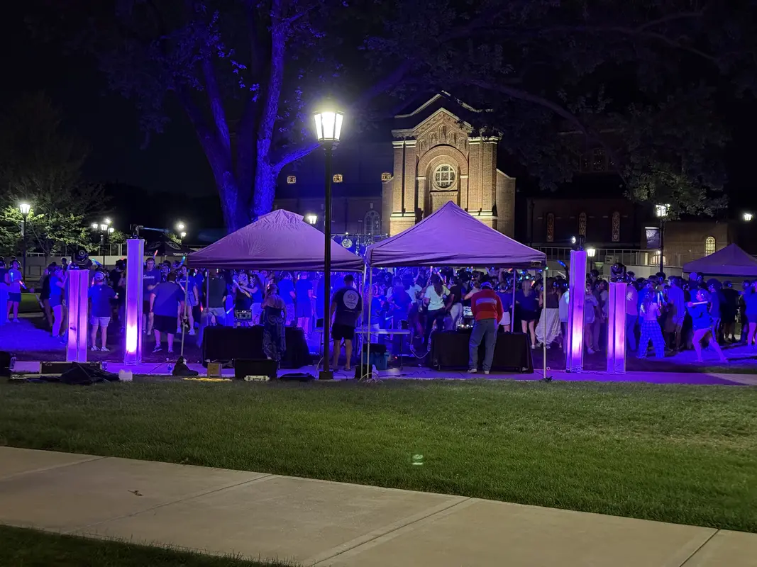 SoundMN DJ performing at an outdoor festival with crowd dancing
