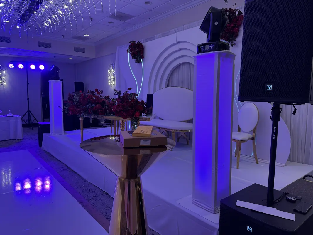 Wedding venue sound and lighting setup with custom monogram on dance floor