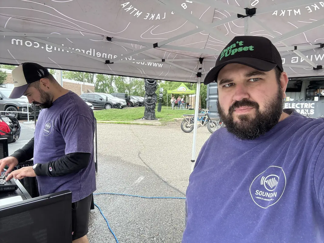 DJ performing with haze effects and LED par lights at an event