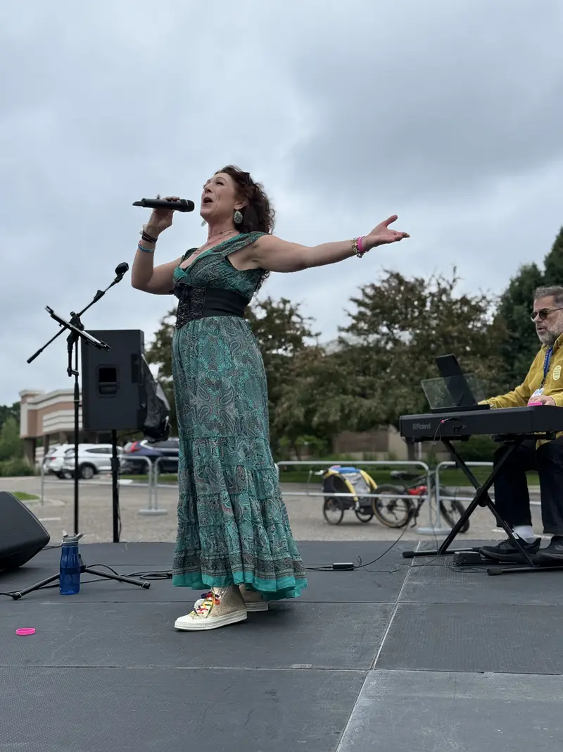 SoundMN team setting up DJ equipment at an outdoor stage event